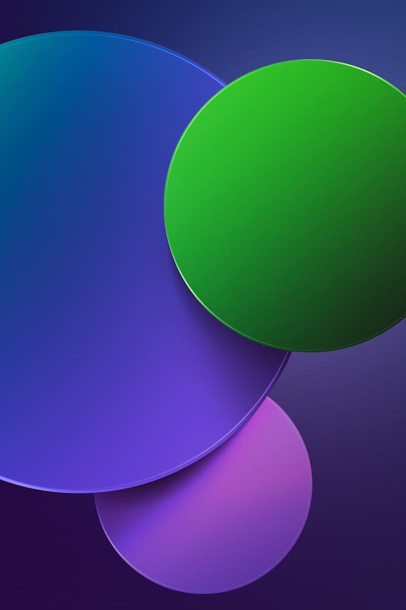 a purple and green background with circles